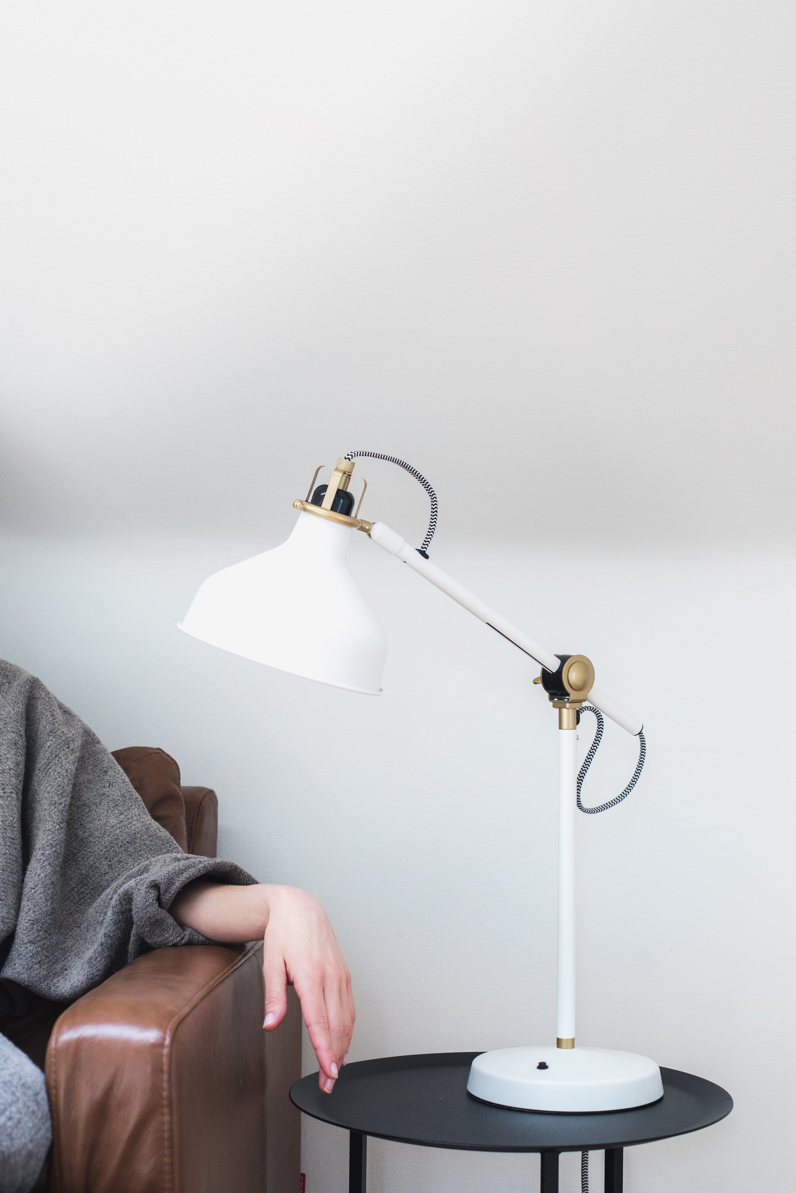 woman-s-hand-on-an-armrest-under-a-lamp.jpg